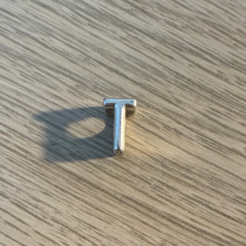 Silver T charm